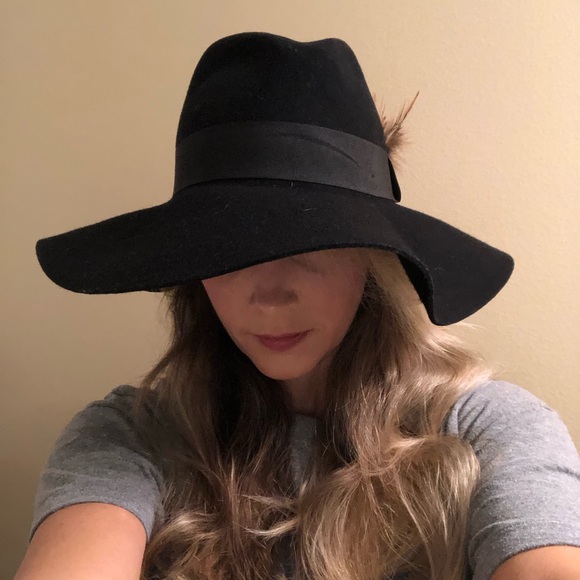Accessories - Black wool hat with feather accent.